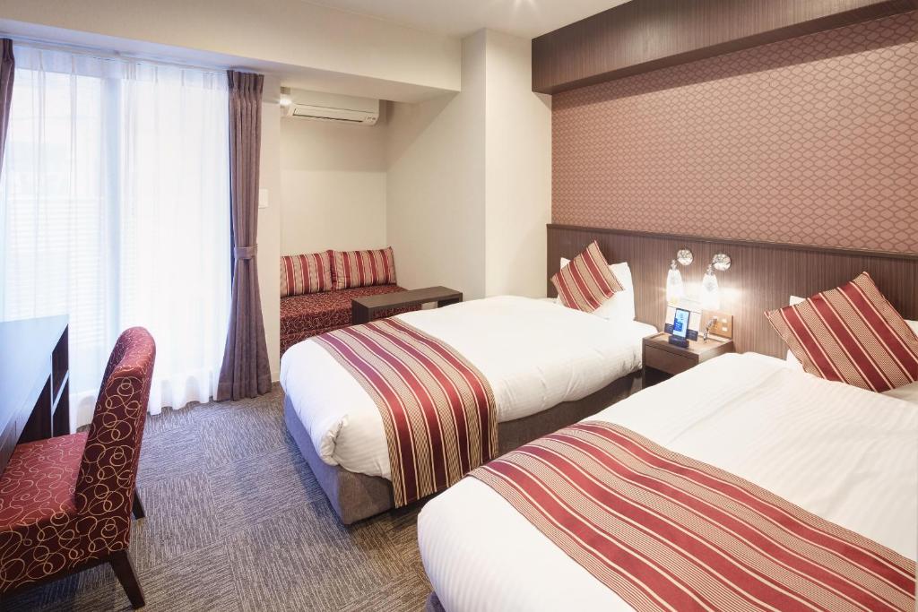 Postel nebo postele na pokoji v ubytování Hotel Amaterrace Yosuga
