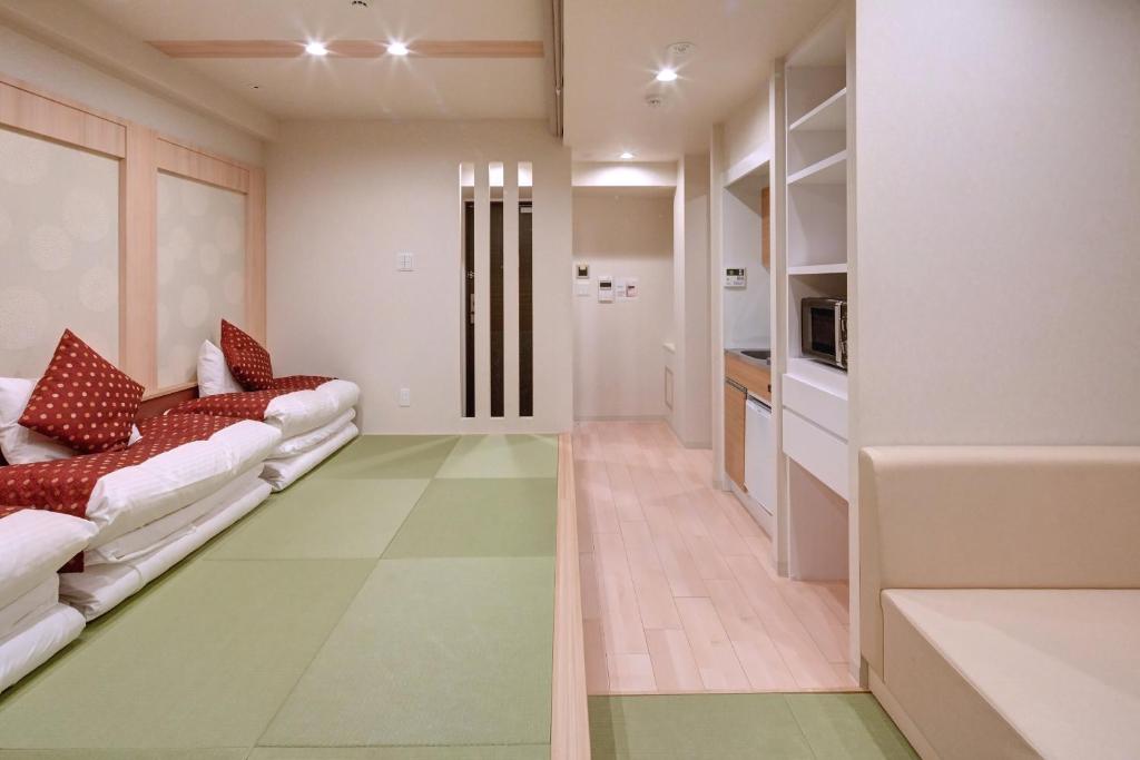 Postel nebo postele na pokoji v ubytování Hotel Amaterrace Yosuga