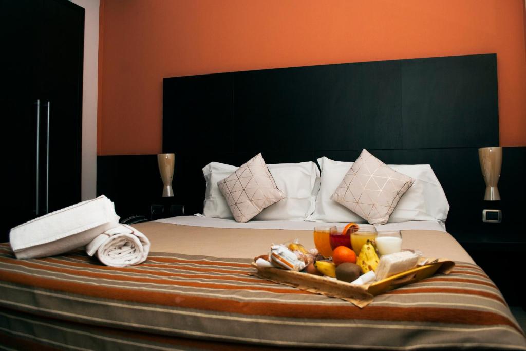 Postel nebo postele na pokoji v ubytování Vercelli Palace Hotel