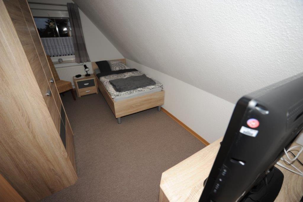 Postel nebo postele na pokoji v ubytování 5 Sterne Ferienhaus Von den Wilden Äckern