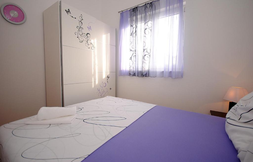 Posteľ alebo postele v izbe v ubytovaní Apartment NOEL
