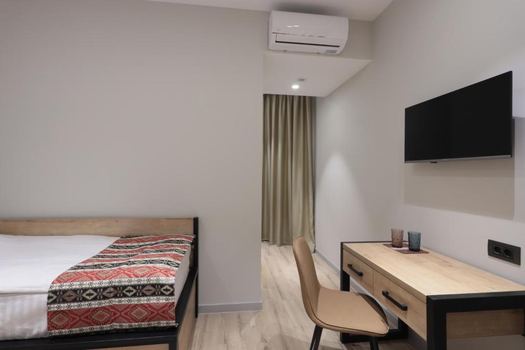 TV a/nebo společenská místnost v ubytování Andor Hotel