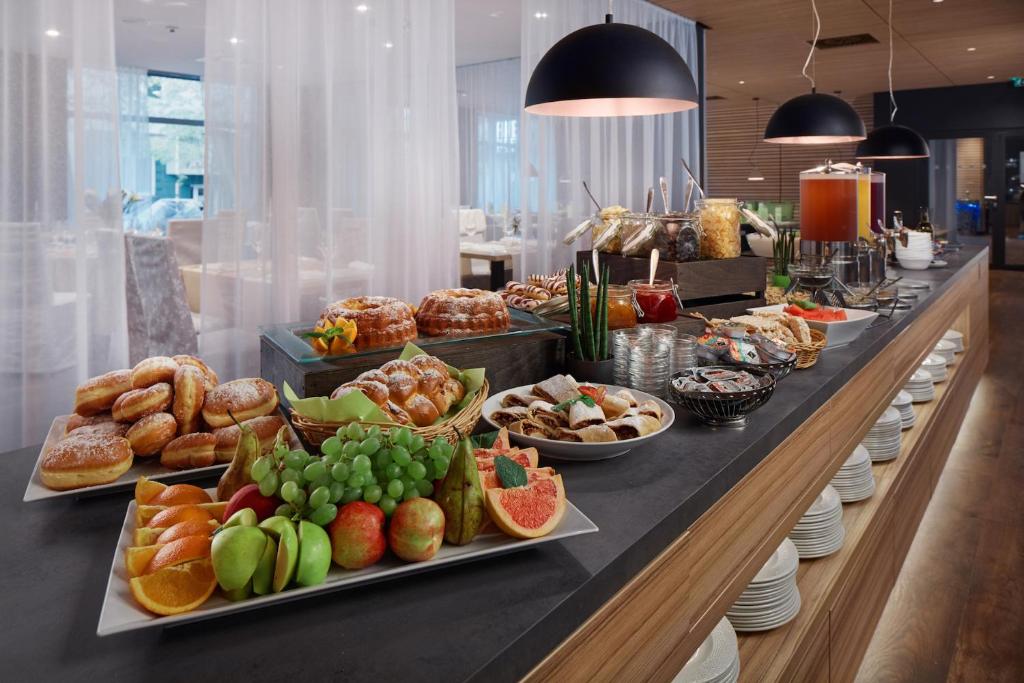 a buffet line with many different types of food at Spa Hotel Felicitas in Poděbrady