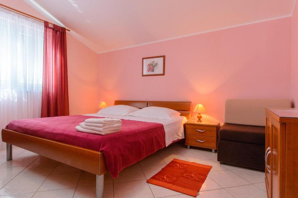 Posteľ alebo postele v izbe v ubytovaní Apartments Anton