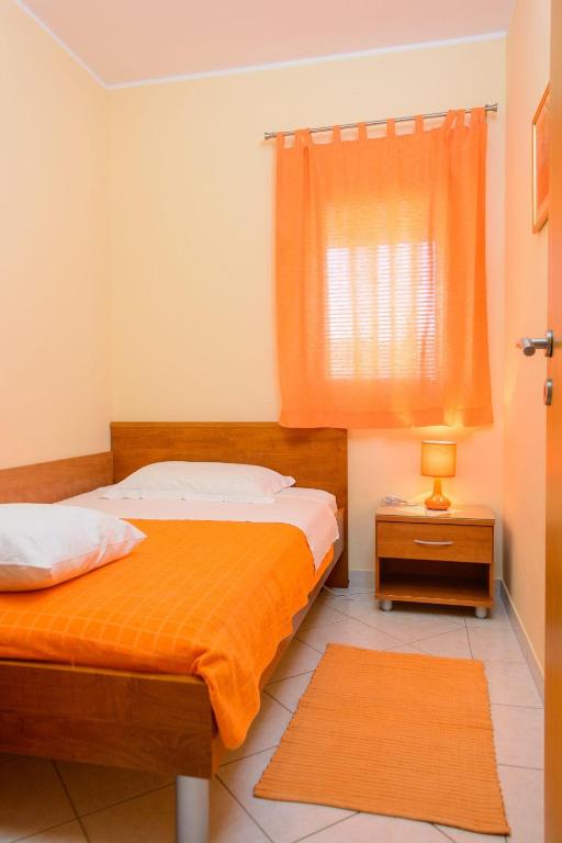 Posteľ alebo postele v izbe v ubytovaní Apartments Anton