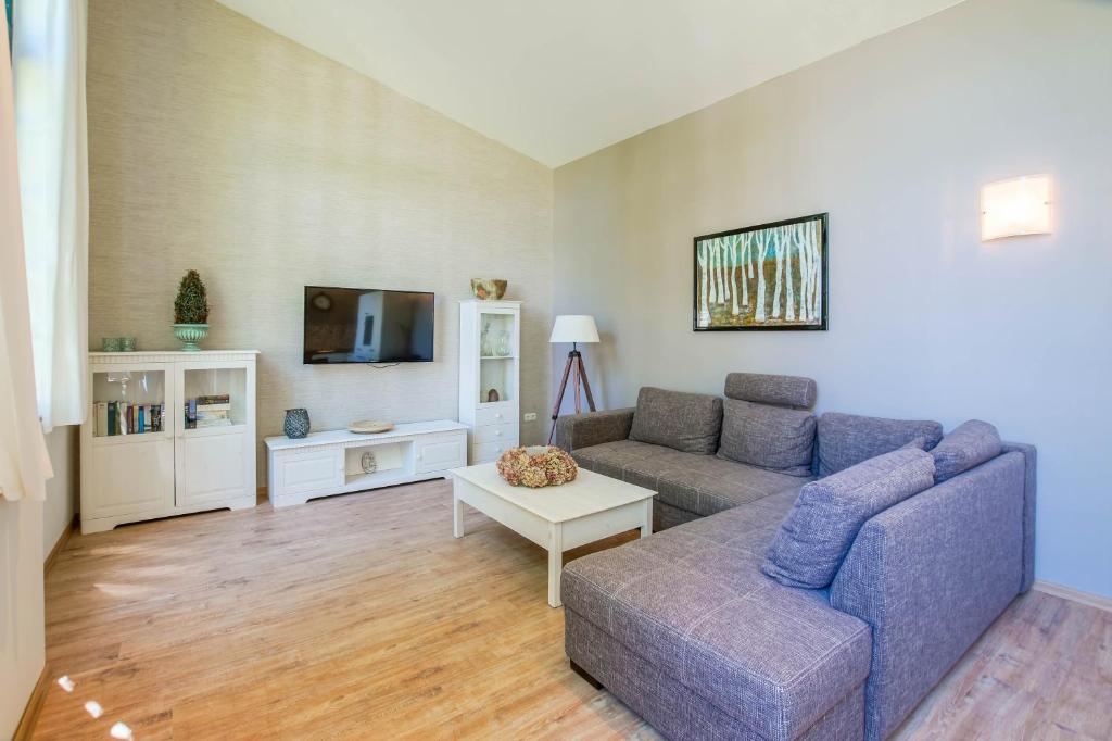 TV a/nebo společenská místnost v ubytování Golf- & Landhotel am alten Deich