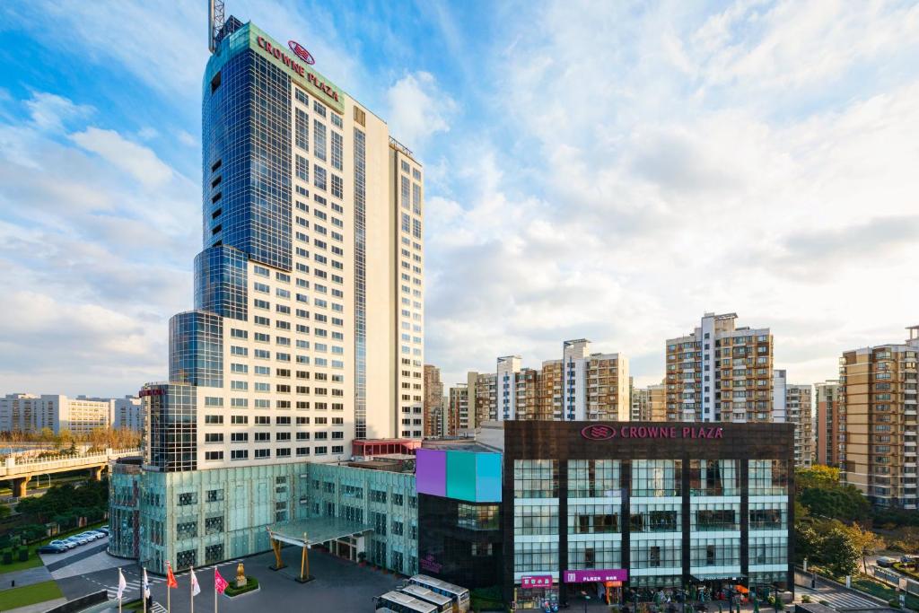 a rendering of a tall building in a city at Crowne Plaza Shanghai Pudong, an IHG Hotel in Shanghai