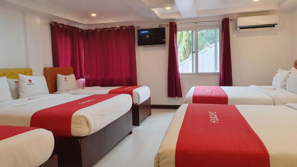 Postel nebo postele na pokoji v ubytování IL Mare Sakura Resort Boracay
