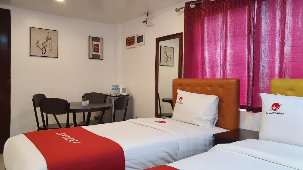 Postel nebo postele na pokoji v ubytování IL Mare Sakura Resort Boracay