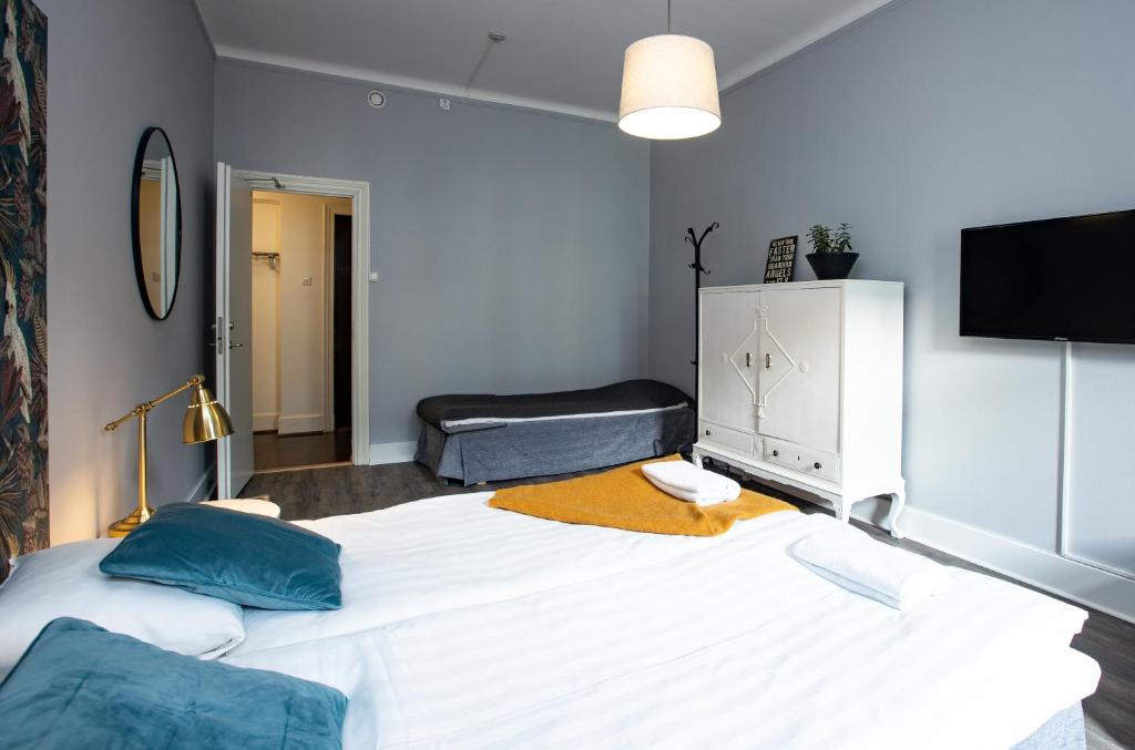 Postel nebo postele na pokoji v ubytování Systrar & Bönor Bed and Breakfast