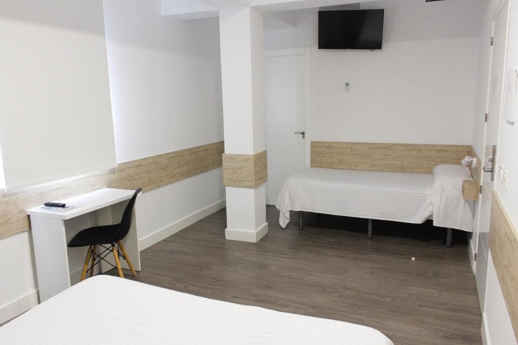 Postel nebo postele na pokoji v ubytování Deluxe Hostels & Suites Merida