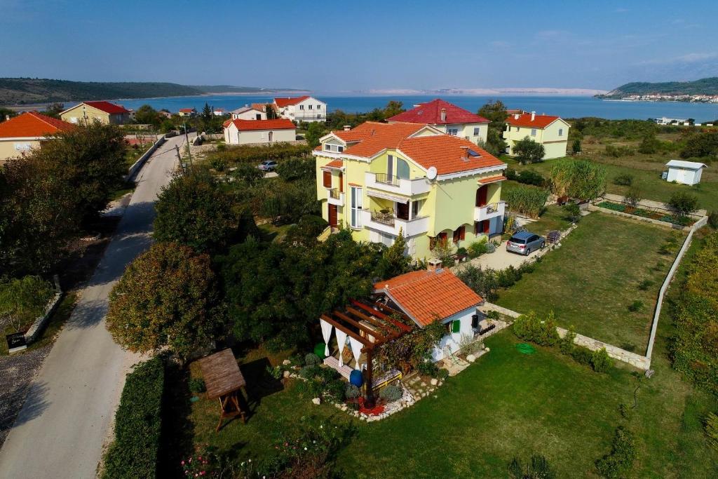 an aerial view of a house with a road at Apartments Secret Garden in Ražanac