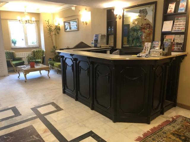 a store with a large black counter in a room at Aleph HOTEL & SPA in Istanbul