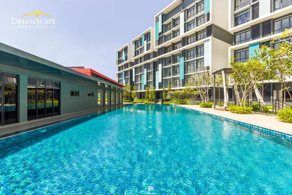 an empty swimming pool in front of a building at Alanis & Core Soho Suite KLIA-KLIA2 By DreamScape in Sepang