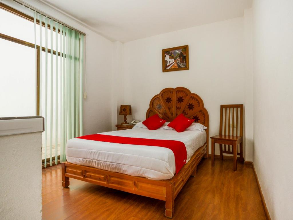 Krevet ili kreveti u jedinici u objektu OYO Hotel Montes, Atlixco Puebla