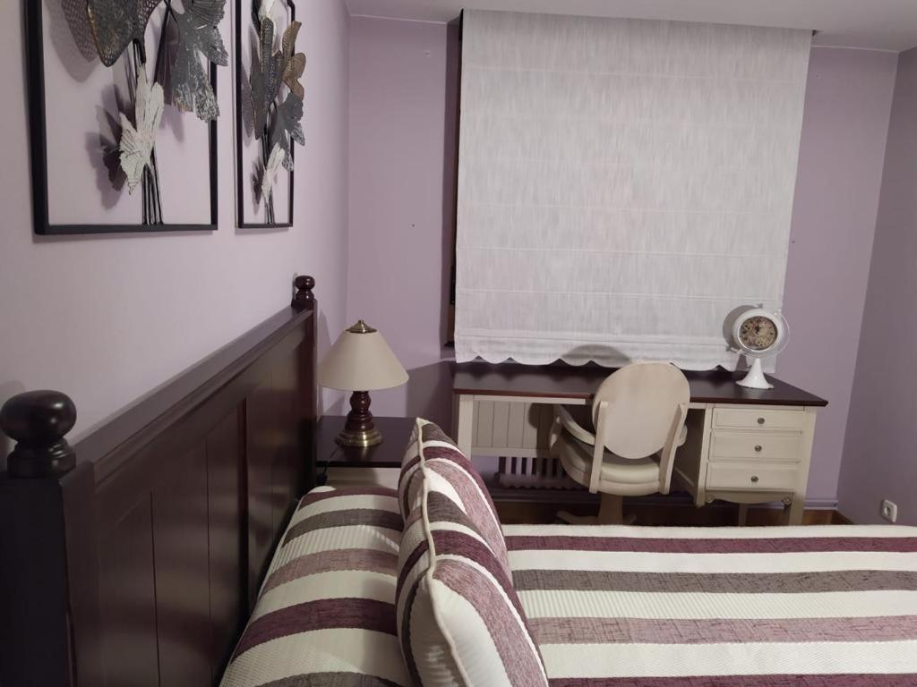 Postel nebo postele na pokoji v ubytování nice apartment Don Santiago