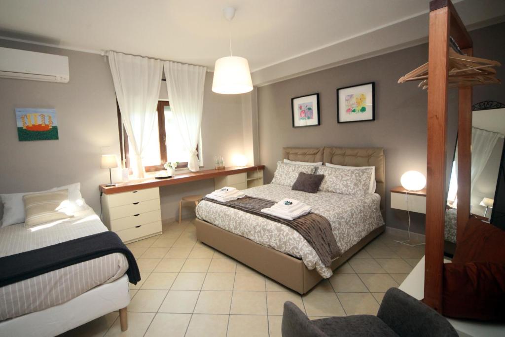 Posteľ alebo postele v izbe v ubytovaní B&B Capuam Vetere Accommodation