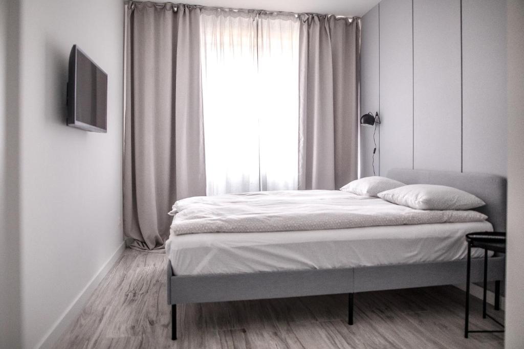 Posteľ alebo postele v izbe v ubytovaní Apartament Nadbystrzycka no.14