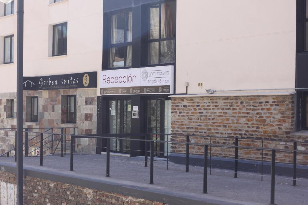 a building with a sign for a restaurant at Apartamentos Montegorbea in Sierra Nevada