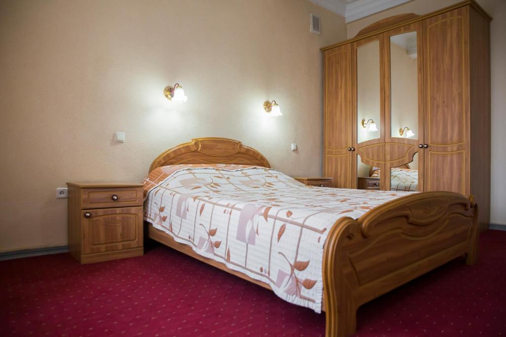 Postel nebo postele na pokoji v ubytování Chisinau Hotel
