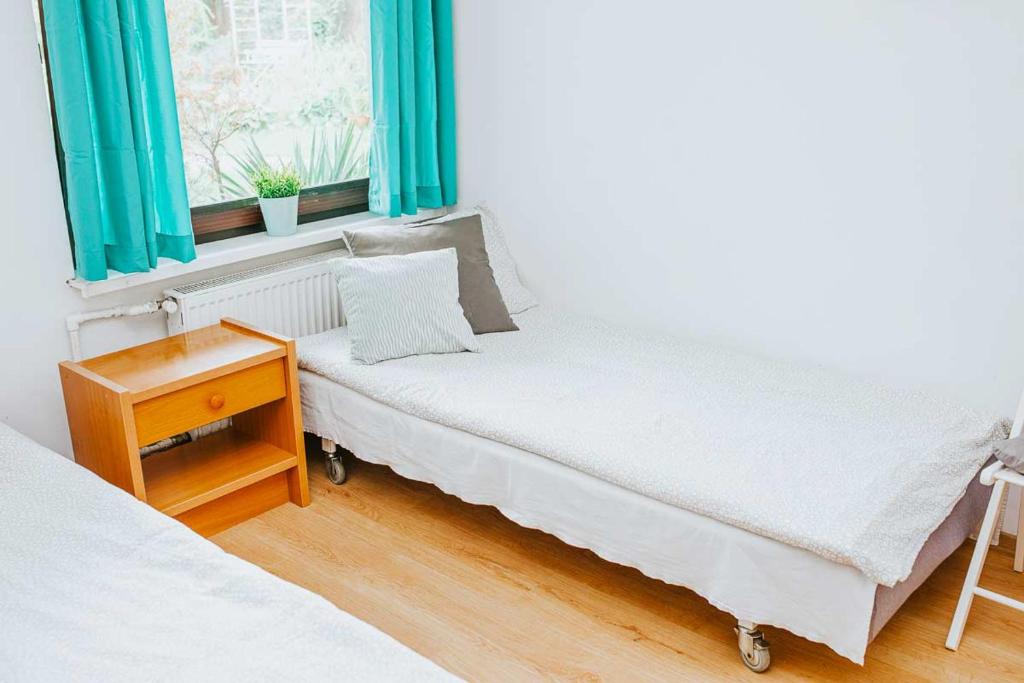 Posteľ alebo postele v izbe v ubytovaní Noclegi u Alicji agroHostel