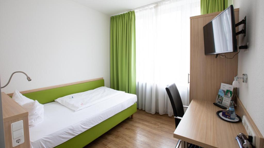 TV a/nebo společenská místnost v ubytování Hotel Astoria