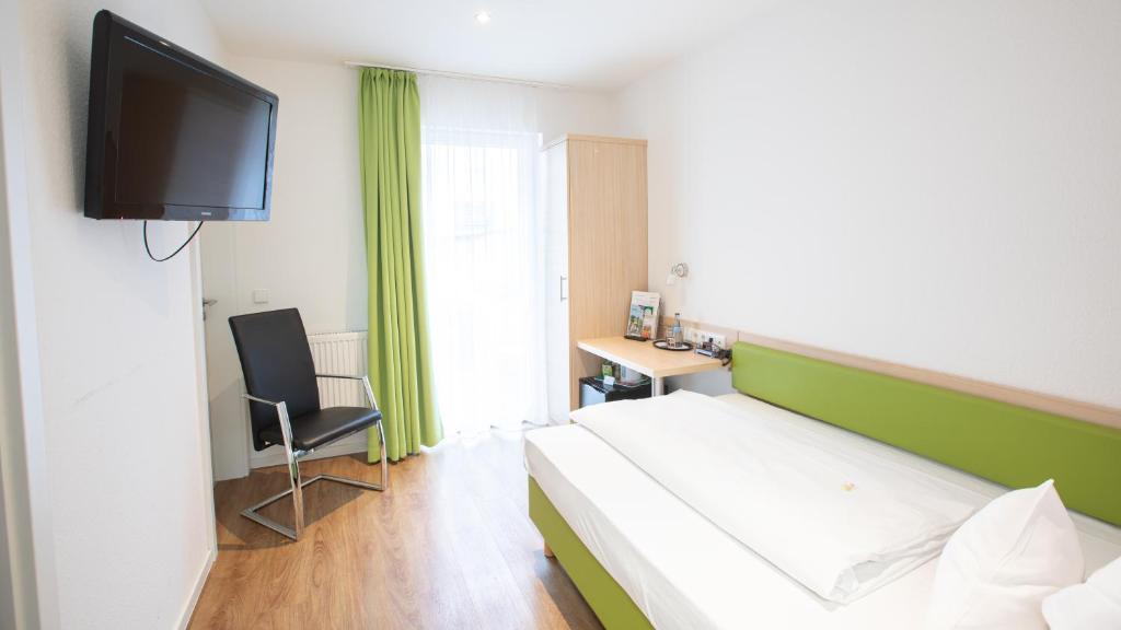 Postel nebo postele na pokoji v ubytování Hotel Astoria