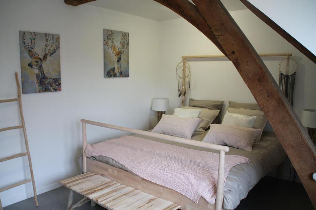 Postel nebo postele na pokoji v ubytování Gîte La feuille d'Acanthe