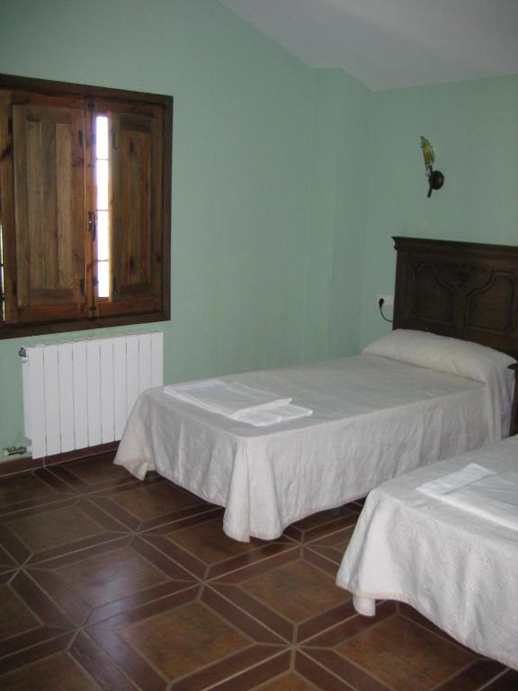 Postel nebo postele na pokoji v ubytování Cortijo El Rey