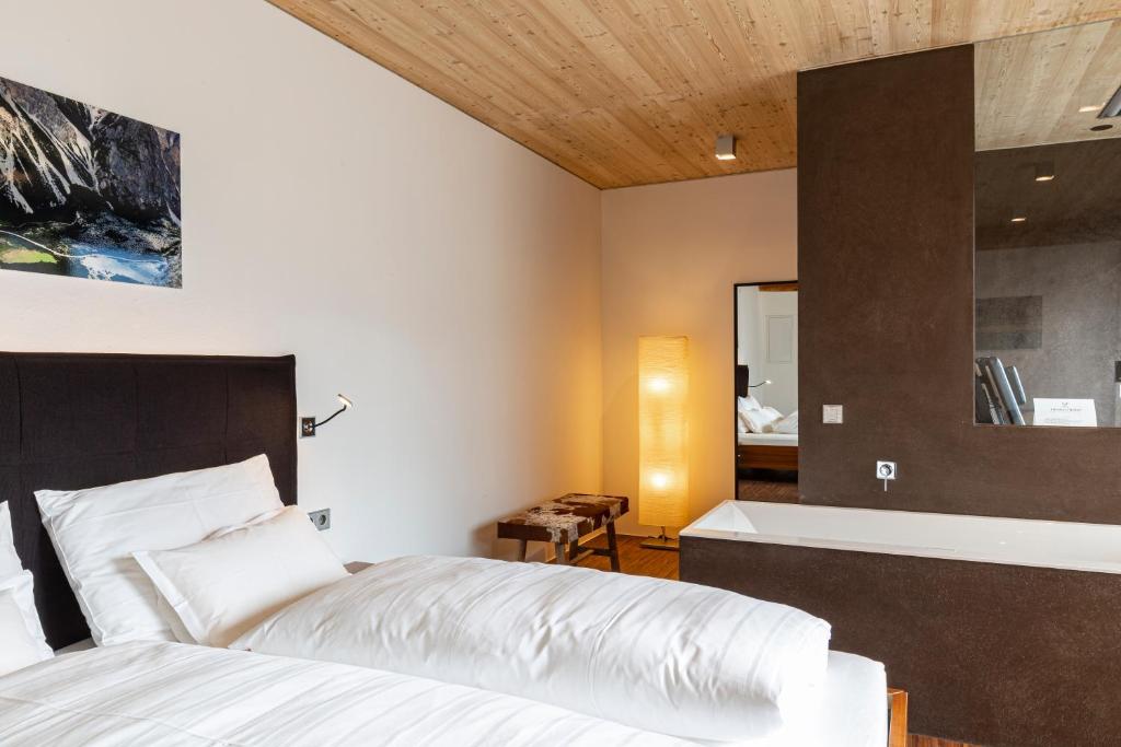 Posteľ alebo postele v izbe v ubytovaní Kronplatz LOFT Bruneck