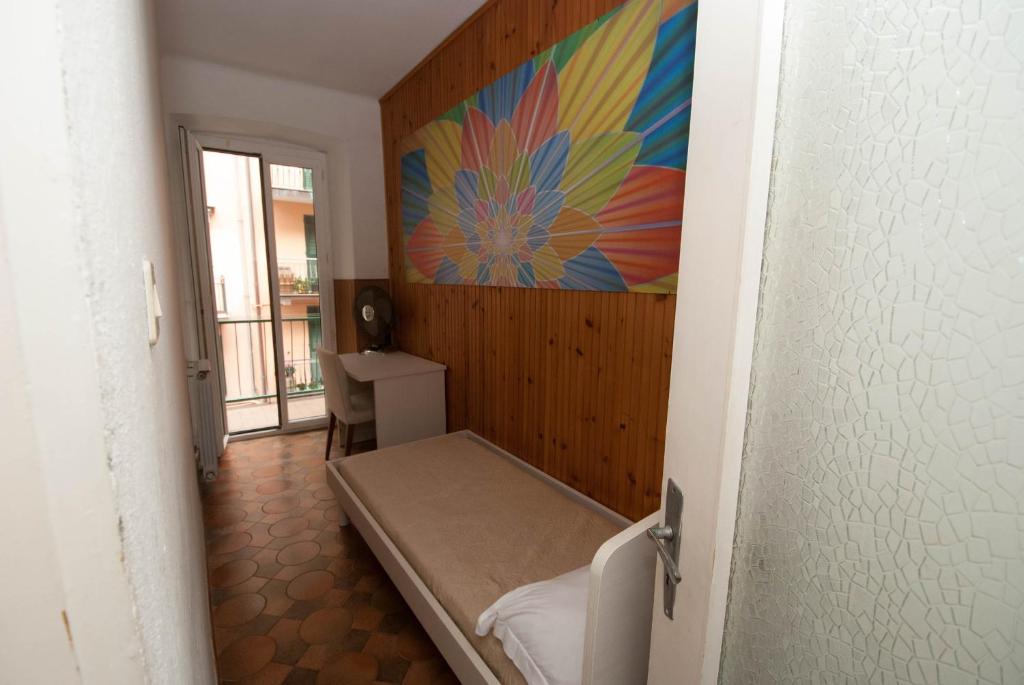 Postel nebo postele na pokoji v ubytování Casa Di Mezzo by Arbaspàa