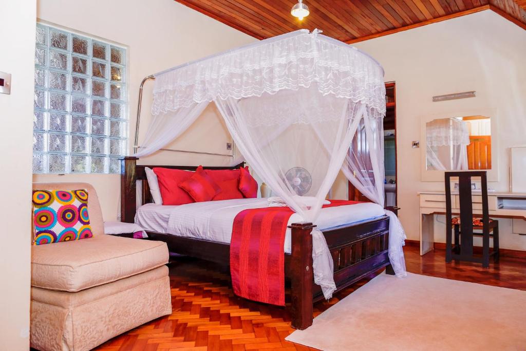 Postel nebo postele na pokoji v ubytování Orchid Homes, Gigiri