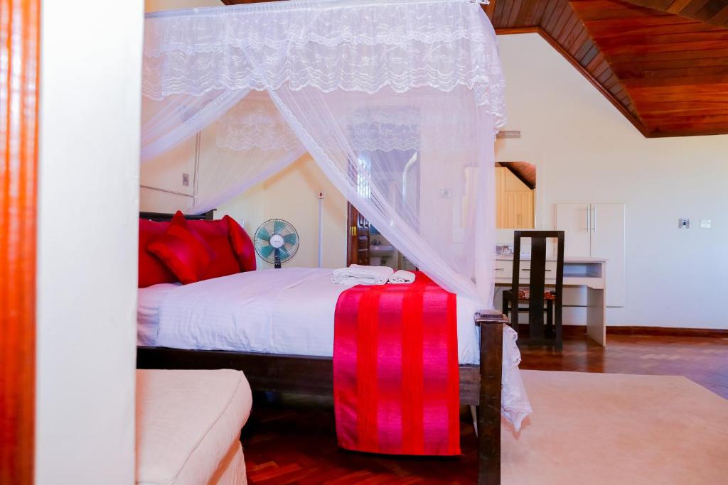 Postel nebo postele na pokoji v ubytování Orchid Homes, Gigiri