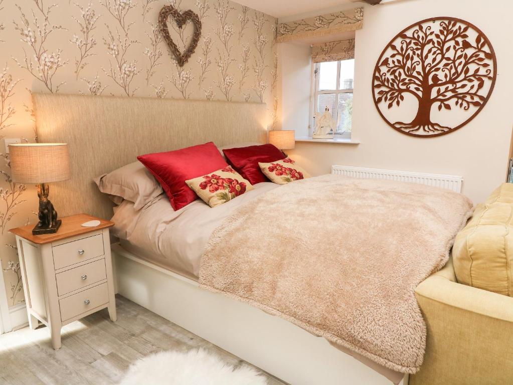 Postel nebo postele na pokoji v ubytování Lottie's Loft