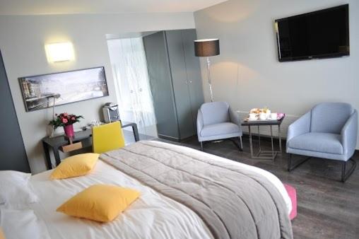 Postel nebo postele na pokoji v ubytování Hotel de L'Universite