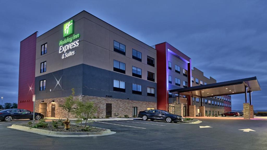 a hotel with a car parked in a parking lot at Holiday Inn Express & Suites Broomfield, an IHG Hotel in Broomfield