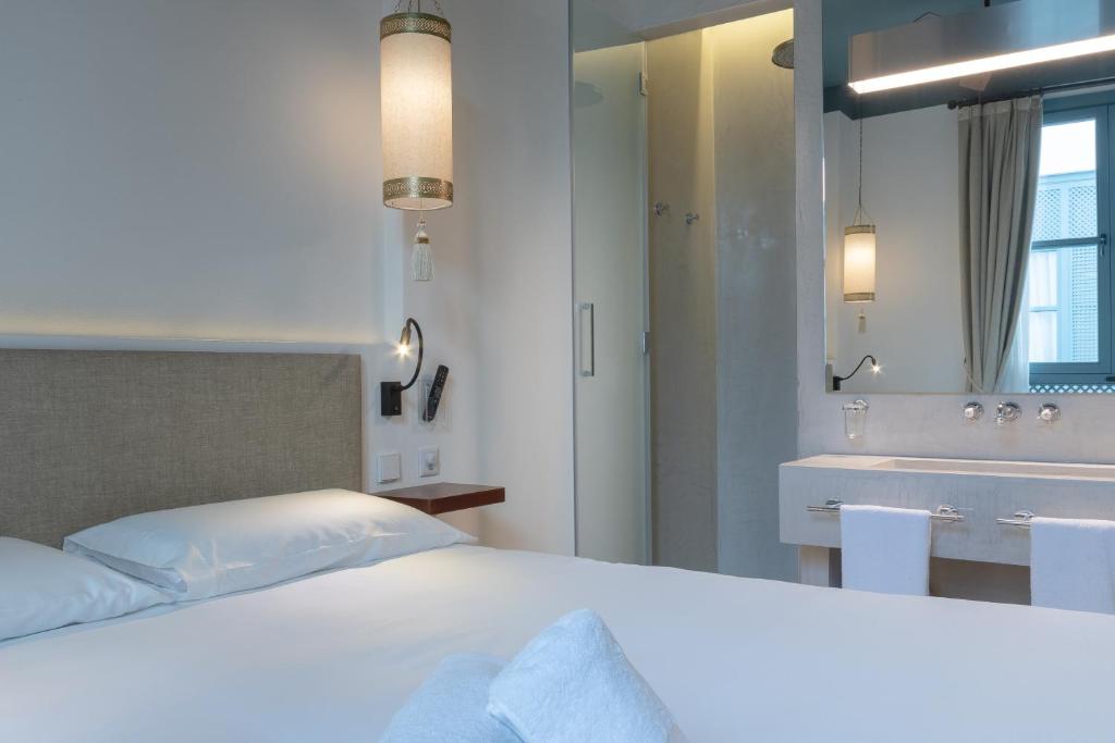 Posteľ alebo postele v izbe v ubytovaní Apartamentos Caminante del Agua