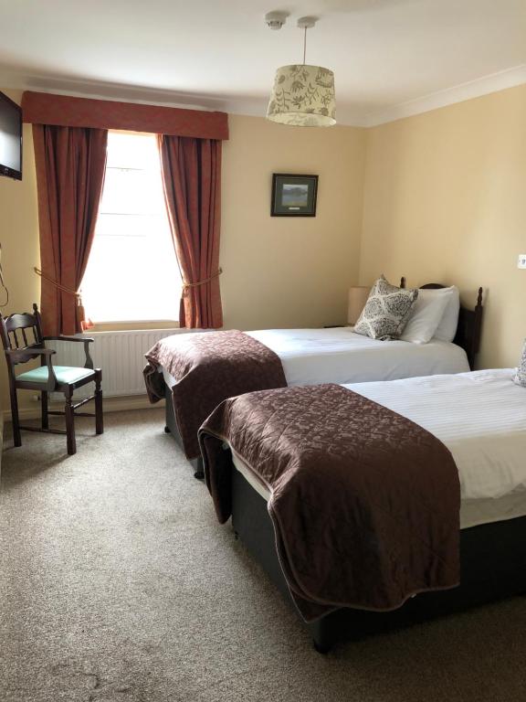 Postel nebo postele na pokoji v ubytování Dun Ri Guesthouse
