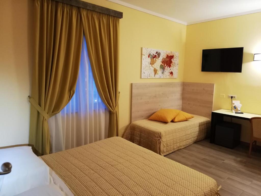 Postel nebo postele na pokoji v ubytování Parc Hotel