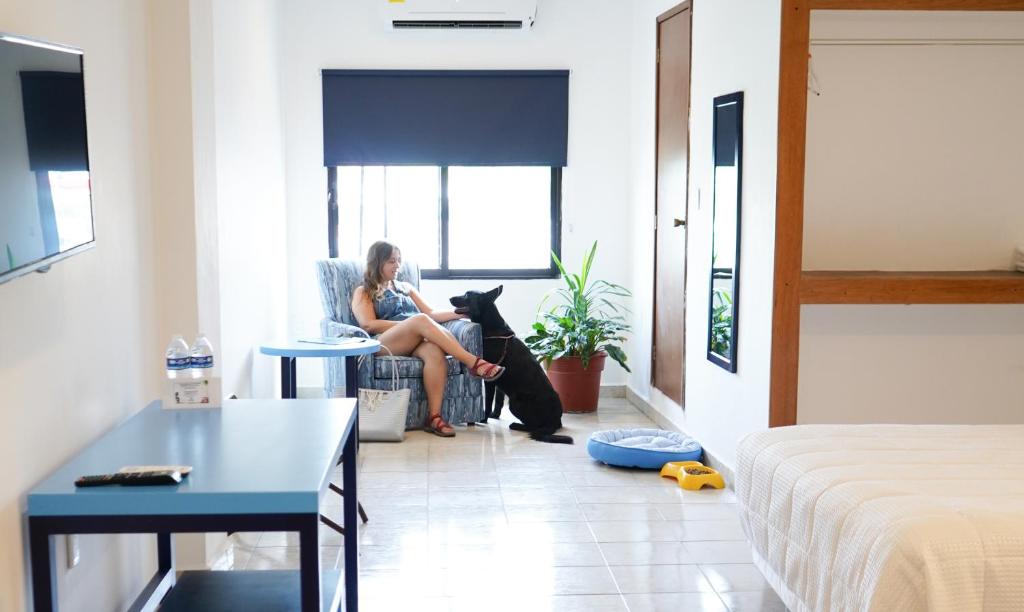 Postel nebo postele na pokoji v ubytování Hotel & Suites Arges - Centro Chetumal