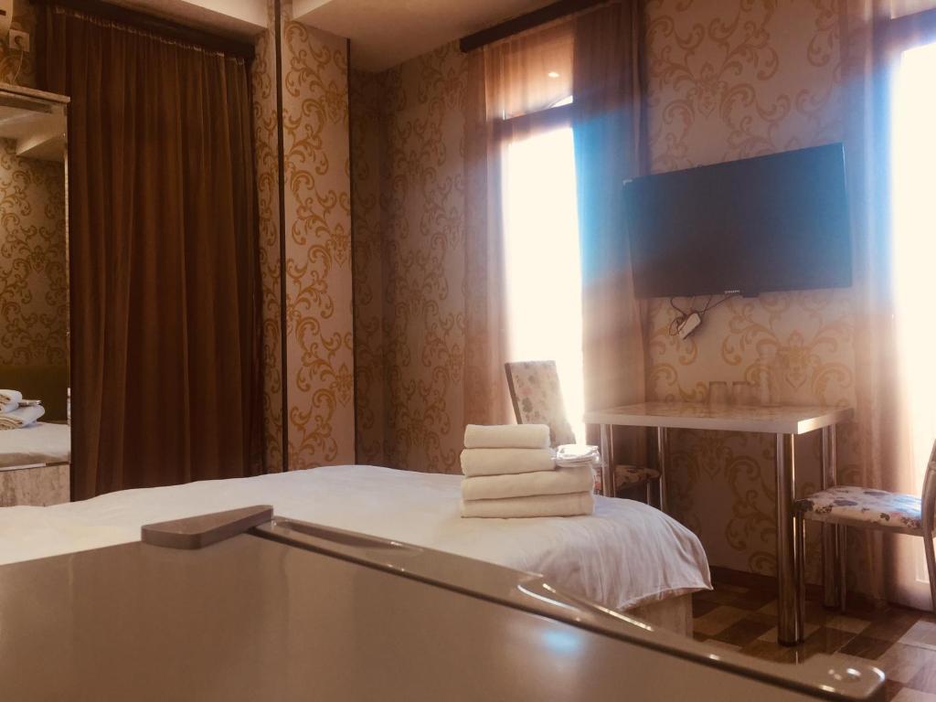 Postel nebo postele na pokoji v ubytování Hotel Tourist
