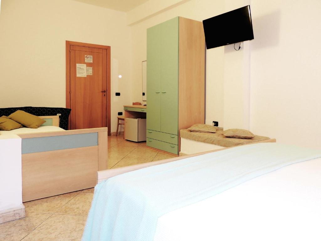 TV a/nebo společenská místnost v ubytování Hotel Porto Badisco