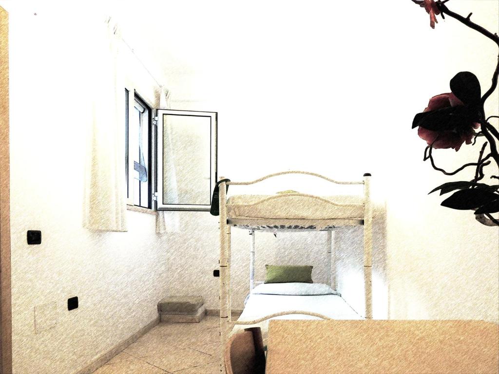 Postel nebo postele na pokoji v ubytování Hotel Porto Badisco