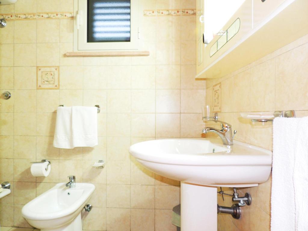 Koupelna v ubytování Hotel Porto Badisco