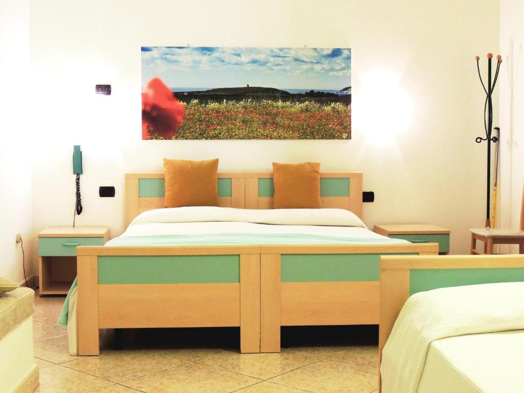 Postel nebo postele na pokoji v ubytování Hotel Porto Badisco