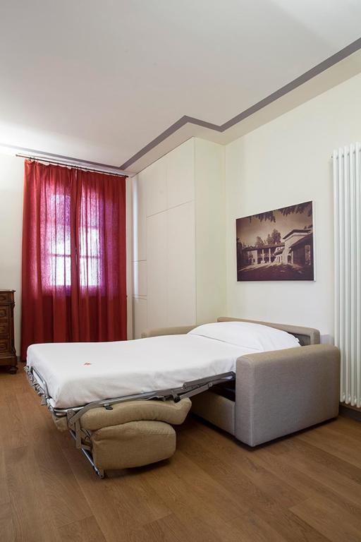 Postel nebo postele na pokoji v ubytování Borromeo Rooms Bed & Living