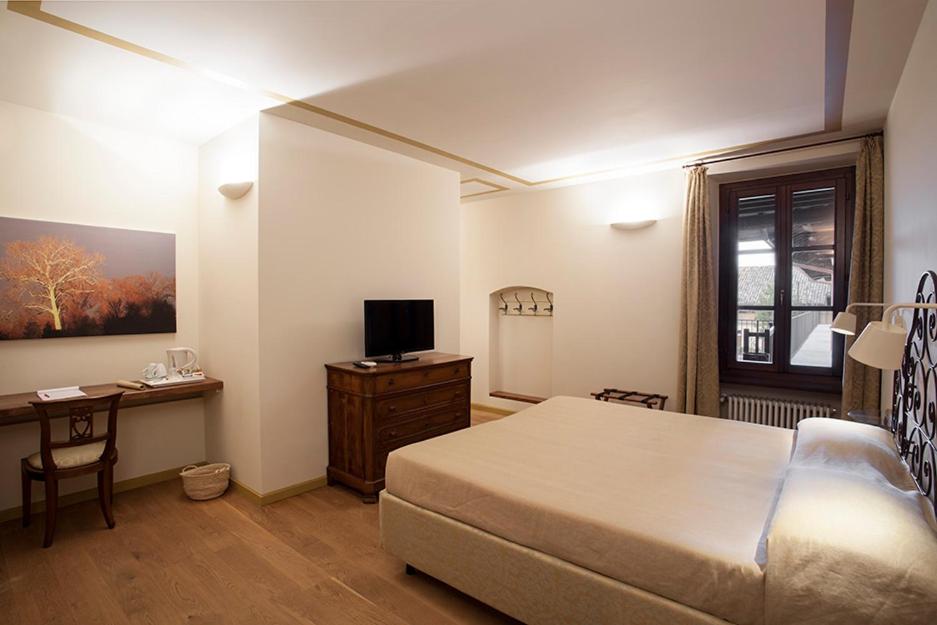 Postel nebo postele na pokoji v ubytování Borromeo Rooms Bed & Living