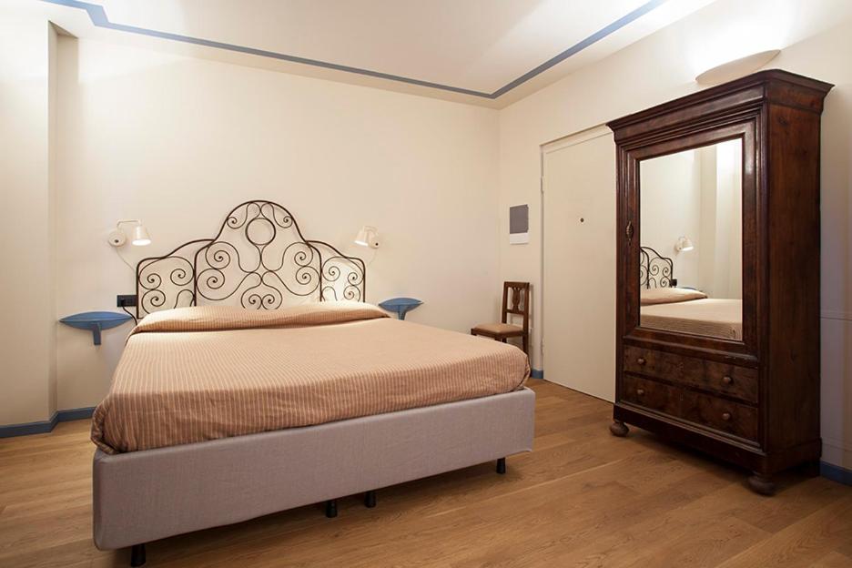 Postel nebo postele na pokoji v ubytování Borromeo Rooms Bed & Living