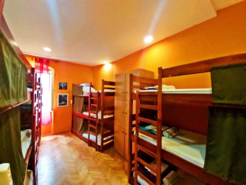 a room with several bunk beds in a room at Hurricane Hostel in Split