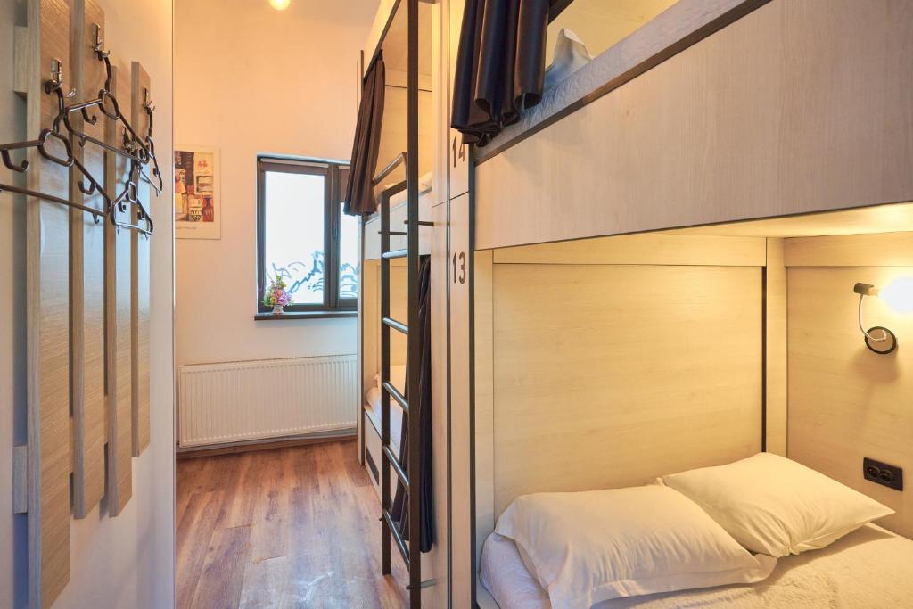 Postel nebo postele na pokoji v ubytování SECRET boutique Hostel